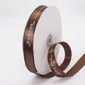 Deep brown satin ribbon with white Happy Birthday text print on a white spool - 2cm / Coffee