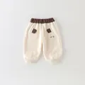 Pantalón beige de algodón para niño con cintura elástica marrón y bordado OK - 73 / Blanco Roto