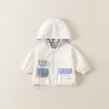 Giacca a vento panna per bambini con simpatica toppa a forma di orso 3D e dettagli blu - 73cm / Beige