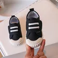Classic black canvas shoes for kids featuring white hook and loop fasteners and rubber toe caps - Black