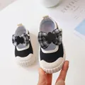 Black canvas baby shoes with a stylish black and white checkered bow and fashion buckle - Size 21 / Black