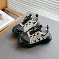 Kids sports sandals in black and white featuring a rotating buckle and breathable mesh - EU 26 / Black