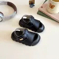 Black kids sandals with closed toe and velcro straps on a minimalist ivory desk setup - EU 21 / Insole 13.0cm / Black