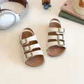 White toddler Birkenstock sandals with brown cork sole and triple metallic buckle straps - Size 21 (13.5cm) / Off White