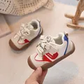 Beige toddler sports shoe with red accents and a protective brown rubber toe cap - 16 / Off White