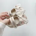 Detail of baby floral Mary Janes with lace bow and cherry embroidery on soft soles - S / Apricot