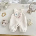 Detailed view of baby bunny romper with 3D ears and embroidery on white fleece fabric - White Overall Romper / 66cm