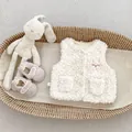 Detailed view of kids fuzzy fleece vest with bunny embroidery and soft sole baby shoes - Tops / Rabbit Style / 73cm