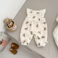 Detail of fleece baby romper with brown bow prints and delicate white lace flutter sleeves - 66 / Beige Apricot