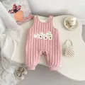 Close-up of pink quilted newborn jumpsuit with cute white rabbit embroidery details - 66cm / Pink