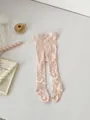 Light pink cable knit baby tights with white satin bow details on clean background - S (0-1 Years) / Pink