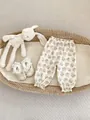 Detail of floral baby bloomers with elastic waist and cuffs in a cozy basket - 73 / Bottoms / Beige Large Flower