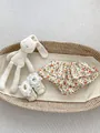 Baby girl floral ruffle bloomers and lace shoes with bunny plush in a wicker bassinet - 73