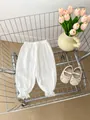 Detailed texture of white double gauze bloomers with lace trim and elastic waist - 66cm / Bottoms / White
