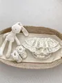 Floral baby bloomers with ruffles and lace soft-sole shoes in a cozy basket setup - 73