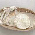 Detail of baby girl lace bodysuit set with floral embroidery and bohemian frills - 66cm / Apricot
