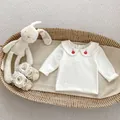 Close-up of white cotton baby top with rabbit embroidery on Peter Pan collar - Size 66 / White Embroidered Shirt