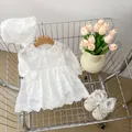 Detail view of baby girl white lace dress with floral embroidery and matching accessories - White / 66cm