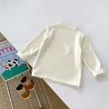 Detailed view of cream baby thermal shirt with soft texture and mock neck collar design - 80cm / White