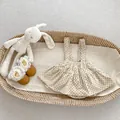 Flat lay of beige polka dot corduroy pinafore dress with brown lace-up baby shoes - 66 / Apricot Polka Dot