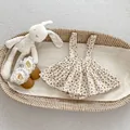 Detail of floral corduroy baby romper suit with lace leather shoes in a basket - 66 / Floral