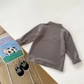 Flat lay of a grey velvet long-sleeve baby shirt with matching monochrome soft-sole shoes - 66CM / Dark Gray