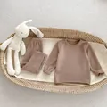 Flat lay of soft mocha brown children's thermal pajama set with a plush bunny toy - Mocha Gray