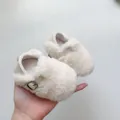 Detailed view of plush baby shoes in beige faux fur with vintage metal buckle and strap - S / White