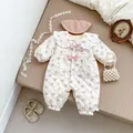 Detail of floral baby romper featuring lace collar, pink bows, and quilted texture - 66cm / Beige Apricot