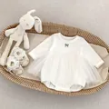 Detail of white long sleeve baby romper with tulle skirt and cute bow print - White / 66cm