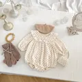 Detail view of floral baby romper with elegant lace collar and matching beret set - 66 / Dot