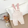 Detail of floral baby romper with rabbit ear straps and lace-trimmed soft shoes - Floral Romper Overalls / 66cm