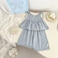 Detail view of girls light blue cotton linen camisole and ruffle wide leg shorts set - 73 / Blue