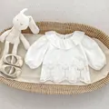 Detail of white cotton shirt featuring ruffled collar and floral embroidery for girls - 73 / White