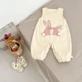 Detail of baby corduroy romper featuring cute rabbit embroidery and 3D pom-pom tails - 66 / Apricot