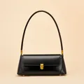 Classic black leather baguette bag with a vintage gold clasp and long shoulder strap - Black