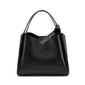 Black pebbled leather bucket bag with top handle and minimalist strap detail - Black