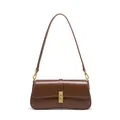 Minimalist dark brown leather baguette bag with a sleek gold rectangular twist lock - Coffee