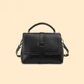 Black leather crossbody bag with beige contrast stitching and vintage bronze hardware - Black