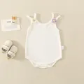 White cotton ribbed baby bodysuit featuring purple and yellow knitted flower details - White / 66cm