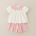 Set estivo per neonata con top bianco a maniche a sbuffo e pantaloncini rosa con fiocchi - 80cm / Set con Revers Grande - Rosa