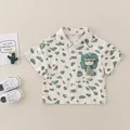 Short sleeve beige cotton shirt for boys with green pebble print and giraffe doll - Green / 73cm