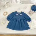Detailed view of girls' denim dress featuring cute cartoon puppy embroidery on collar - Dresses / 73cm