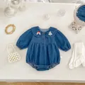Detailed view of baby denim romper with Peter Pan collar and cartoon embroidery - Baby Romper / 66cm