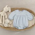Light blue baby long sleeve bodysuit featuring lace collar and bow embroidery in a basket - 66 / Blue