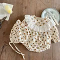 Flat lay of floral baby romper with vintage lace collar and matching bonnet on wood - 66CM / Long Sleeve Romper With Hat / Orange Floral