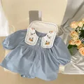 Detail of baby bodysuit featuring white Peter Pan collar with colorful floral embroidery - 66 / Blue