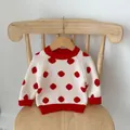 Infant cream knit sweater with bold red polka dots and ribbed trim on a wooden hanger - Polka Dot Top (Red Dots) / 66cm