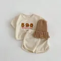 3-piece baby waffle knit set with bear embroidery and brown beanie in cream color - Apricot / 66cm