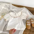 White cotton baby bodysuit with floral embroidery and ruffled Peter Pan collar - Size 66 / White Top